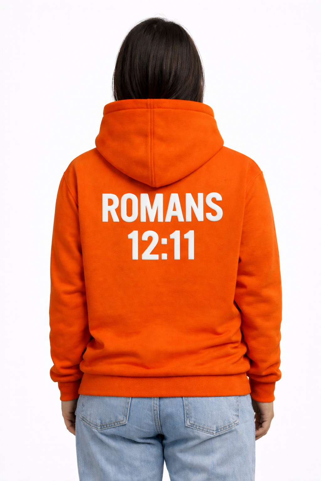 women wearing an orange hoodie with 'ROMANS 12:11' text on the back, standing against a white background.