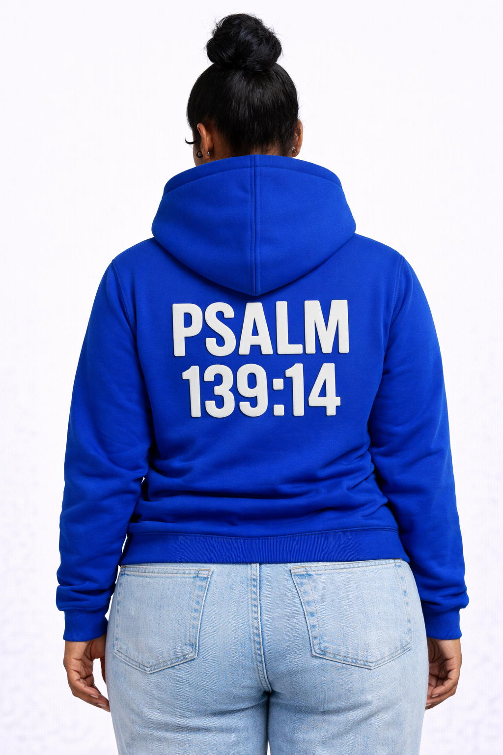 Person wearing a blue hoodie with 'PSALM 139:14' printed on the back against a white background