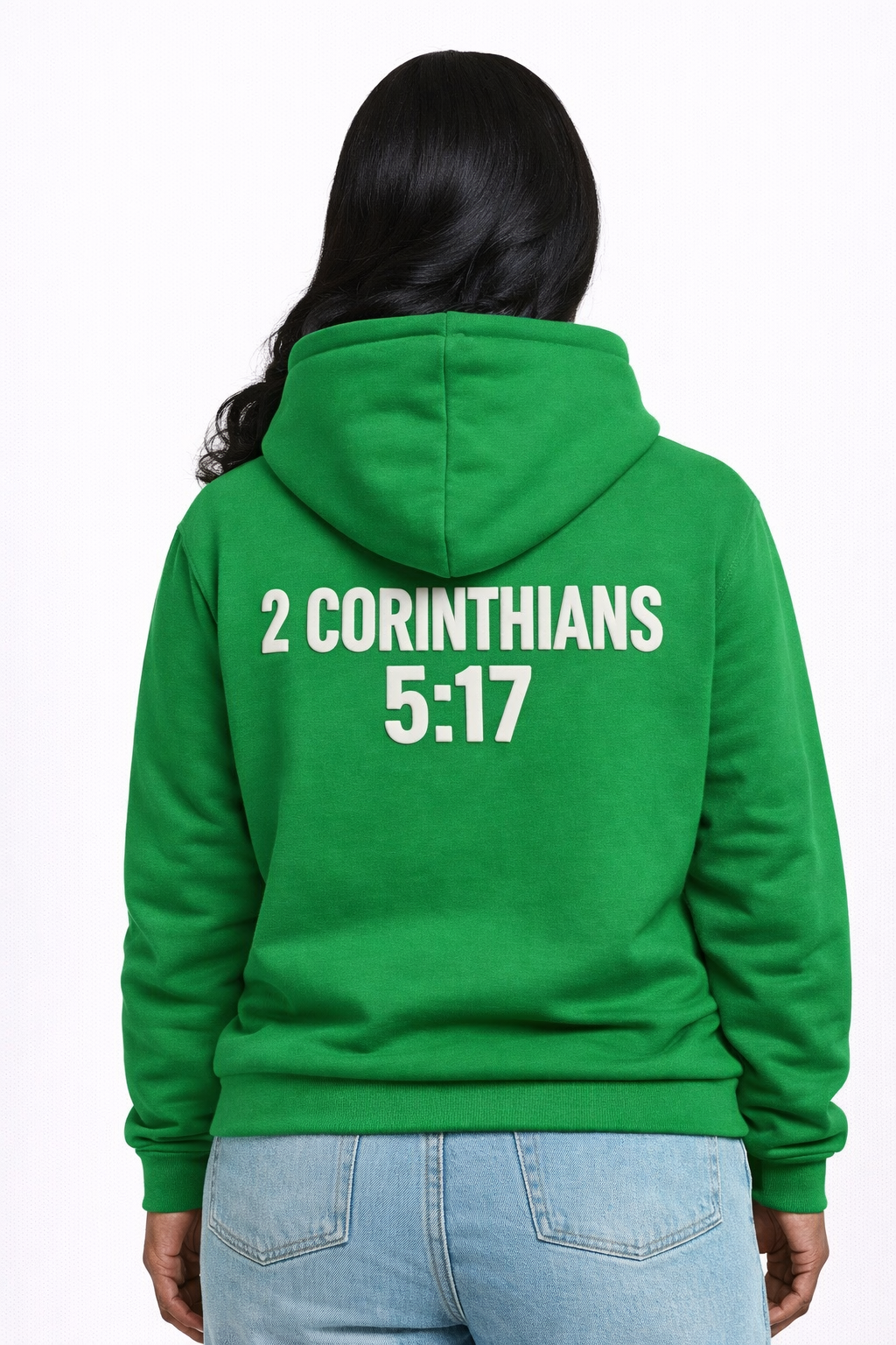Green hoodie with '2 Corinthians 5:17' text on the back, worn by a person.
