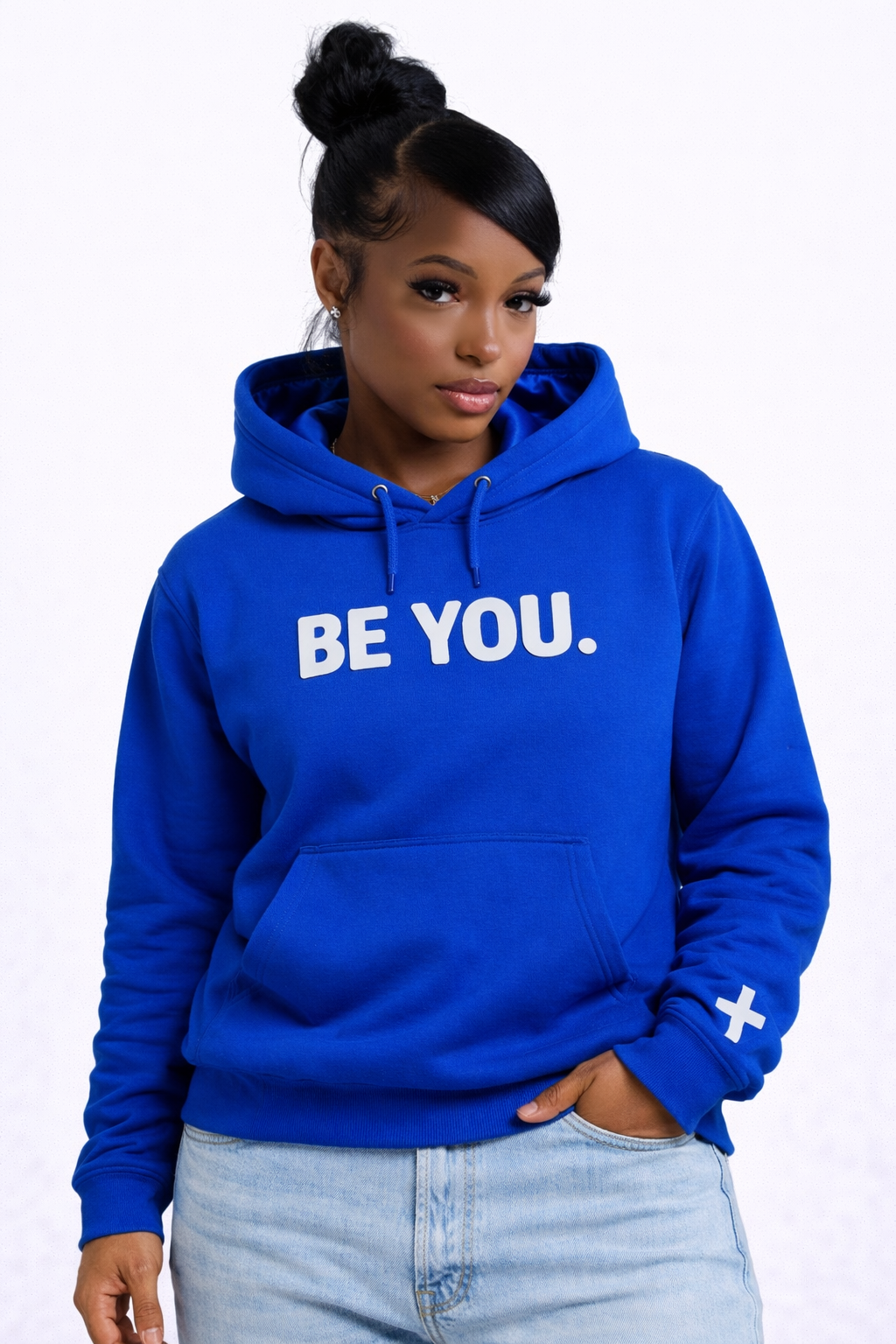 Person wearing a blue hoodie with 'BE YOU.' text on a white background