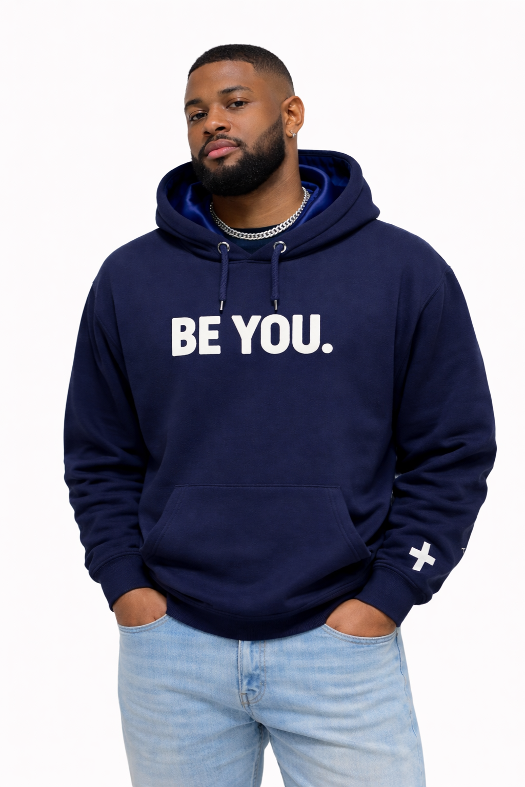 Man wearing a navy hoodie with 'BE YOU.' text on a white background