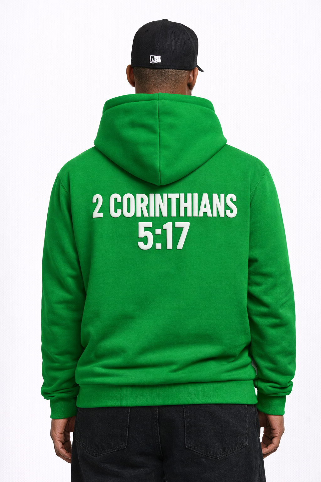 Person wearing a green hoodie with '2 Corinthians 5:17' text on the back.