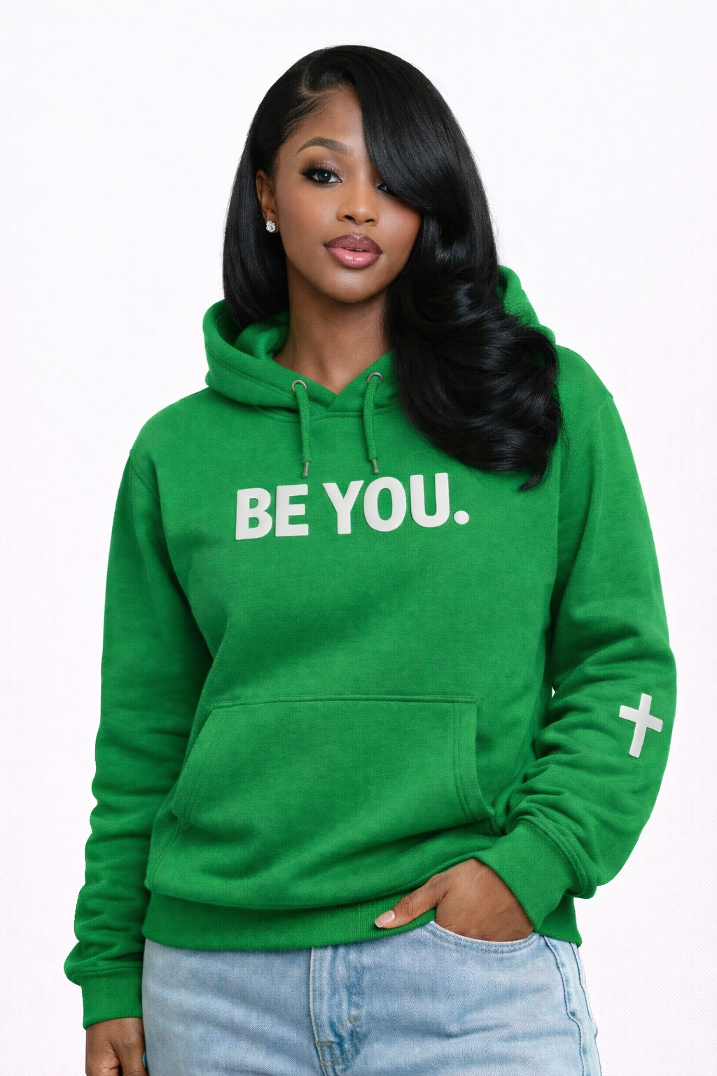 Woman wearing a green hoodie with 'BE YOU.' text on a white background
