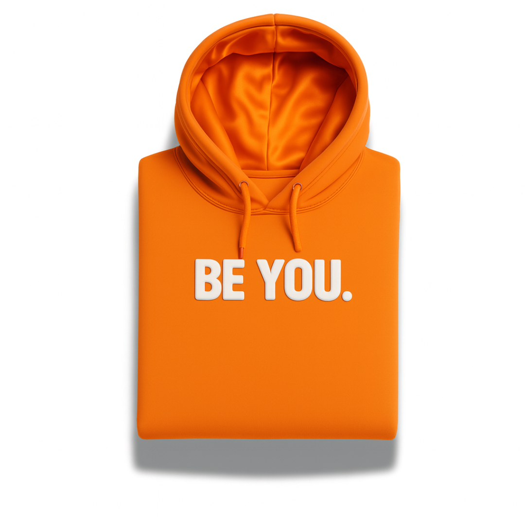 Orange satin-lined “BE YOU” Christian hoodie from Savior Brand, folded front display with bold white lettering.