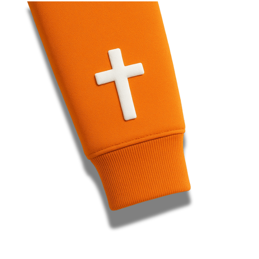 Detailed sleeve view of the orange Ablaze Christian hoodie from Savior Brand, showcasing a bold white cross design.