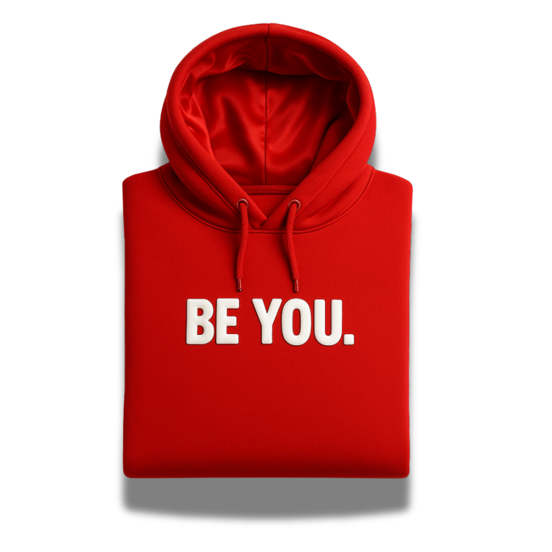 Folded red Covenant hoodie with satin-lined hood and bold white “BE YOU.” design, part of the Savior Brand Christian streetwear collection.